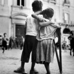 Boy Helps Amputee Friend Injured in War in Naples, Italy - By Henri Cartier Bresson, 1944